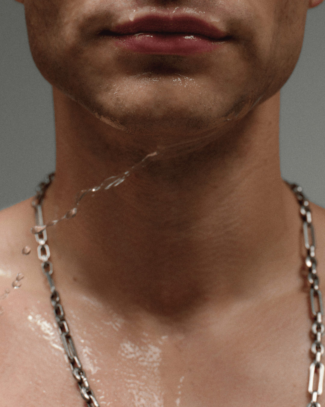 Water moving across freshly cleansed skin below the lips