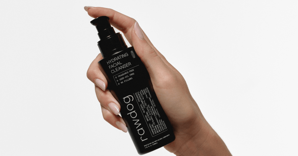Hand holding RAWDOG Hydrating Facial Cleanser for a shared skincare routine