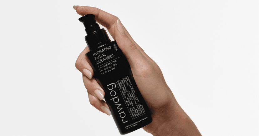 Hand holding RAWDOG Hydrating Facial Cleanser for a shared skincare routine