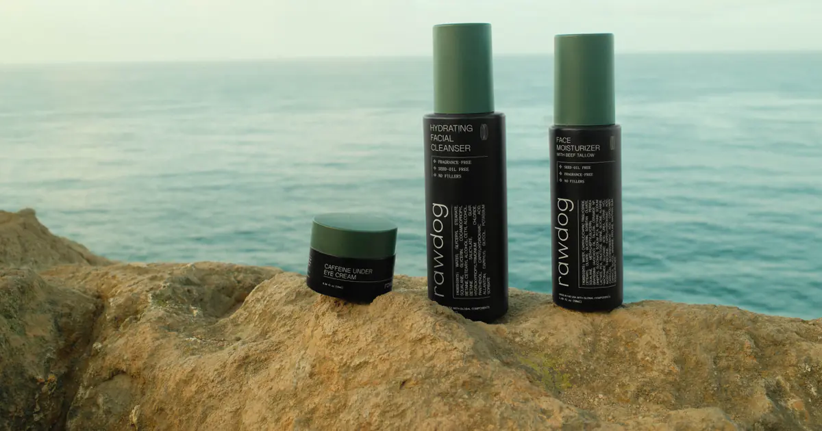 RAWDOG Hydrating Facial Cleanser with moisturizer and eye cream on a Malibu cliff