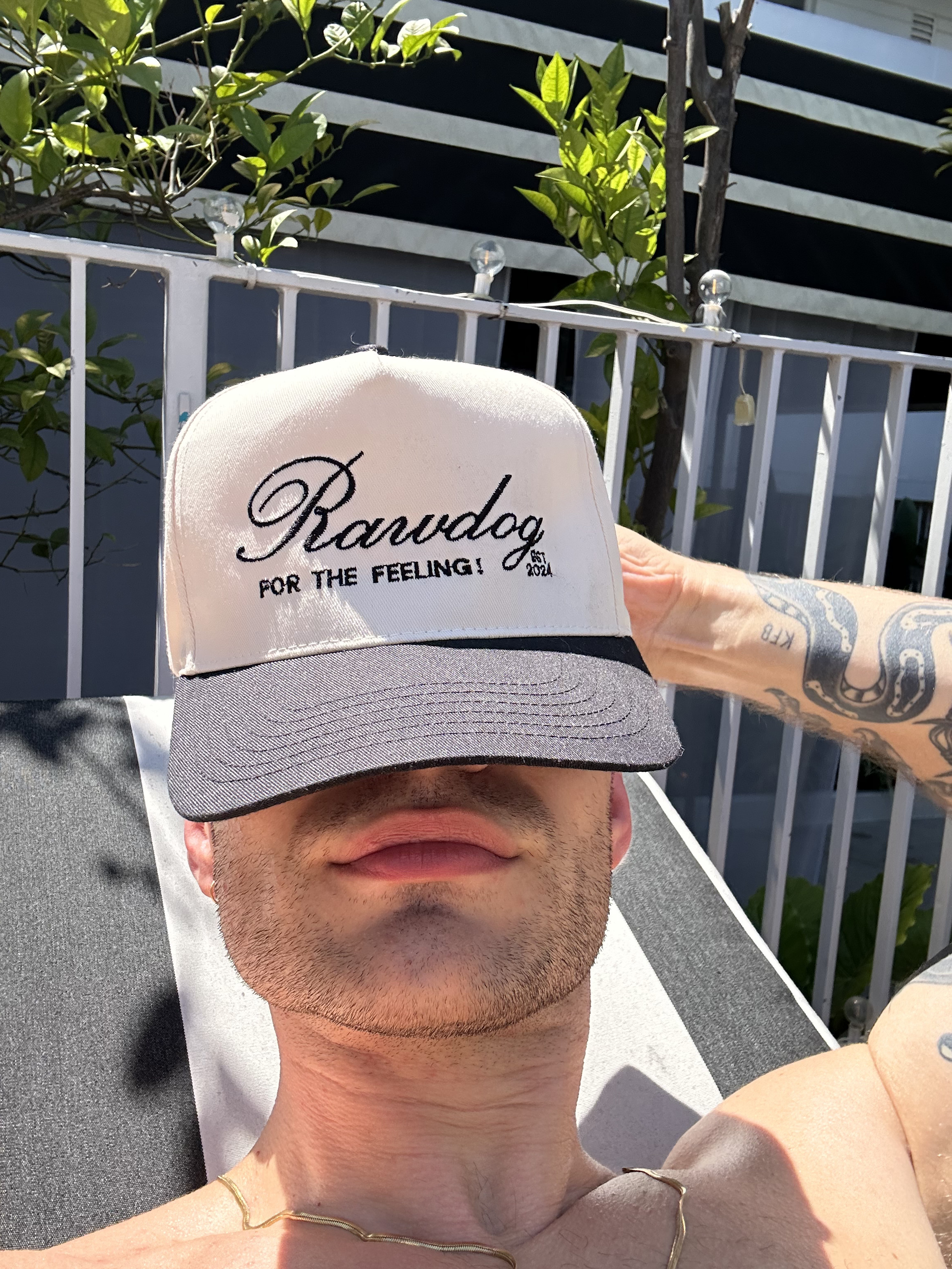 Man wearing RAWDOG Trucker Hat